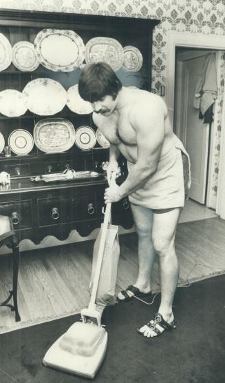 Ron Curl takes his turn at tidying up around the house