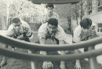 An intimidating view: St. Michael's College quarterback Francis Greco sets up behind Carmine Perrelli while Andrew Martin, left. and Ivan Boddy, right(...)