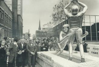 Stainless-steel statue unveiled yesterday outside the newly opened Football Hall of Fame in Hamilton is titled Touchdown and represents football in ge(...)