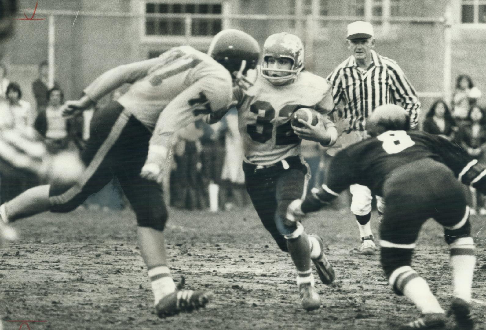 Marcello Oliverio (left) of Oakwood Barons appears ready to tackle teammate  Mike Scuglia in TSSAA senior football game at Oakwood yesterday. Scuglia  s() – All Items – Digital Archive : Toronto Public Library