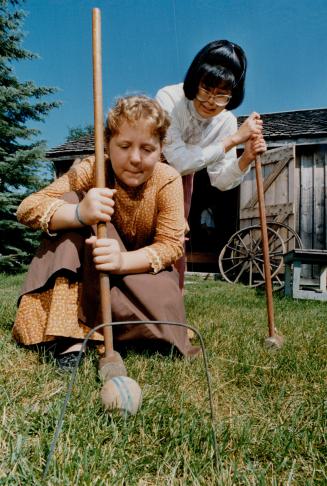 Old time croquet anyone? Becky Schofield, 12, with historical interpreter Alison Miki, trys her hand at turn-of-the-century croquet at the Scarborough(...)