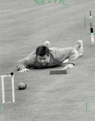Lying down on the job. Coaxing the ball or getting one's clothes muddled isn't something out of the ordinary for a croquet player. Ross Robinson of St(...)