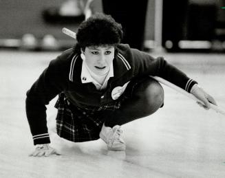 Now that's concentration. Wendy Bain, lead for the Alberta rink, wishes her shot well during yesterday's game against B.C. foursome at the mixed curli(...)