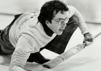 Now sweep! John Cushing of Keene's Ron Manning foursome follows shot during opening-day play of Labatt Tankard Ontario men's curling championships at (...)