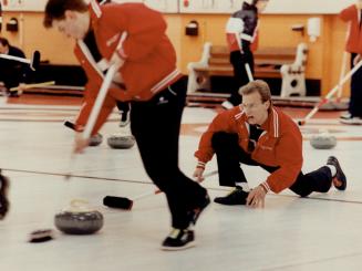 Take it away, boys. Steve Hambrook, skip for the R.A. Curling Club of Ottawa, releases a stone during his match against the Tam Heather Country Club o(...)