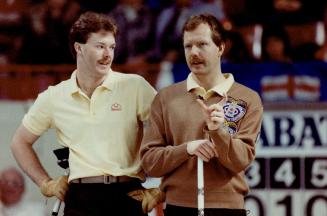 Ontario third Glenn Howard, left, and his brother Russ, skip of the Ontario rink