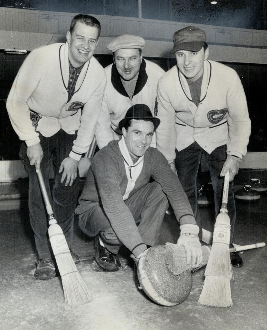 Toronto Bonspiel winner Bayne Secord cleans off stone