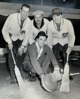 Toronto Bonspiel winner Bayne Secord cleans off stone