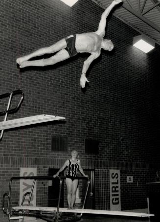Taking a dive: Stouffville resident Fritz Hesse, 80, takes a dive off the board at Markham Centennial arena's pool