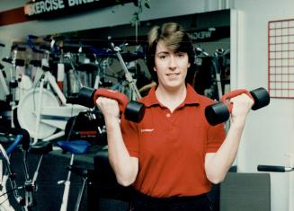 Staying fit: Susan Jennings, manager of Fitnessland, demonstrates use of free weights