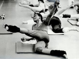 Al Greene leads students, including Global TV's Ann Rohmer, above, through a strenuous one-hour workout