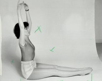 4 Stretch your arms above your head and straighten your legs, curl back into the tucked position, then slide back to Step 1