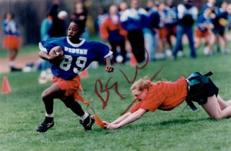 Woburn speedster flagged. Fleet-footed Tamara Ferron of Woburn almost evades a desperate tackle by Mowat player. Ferron made several great runs during(...)