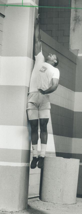 Rookie Mark Woodson shows how high he could jump for a pass,