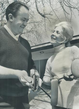 Margie Muir of Islington checks over some clubs with assistant pro Albert Southgate