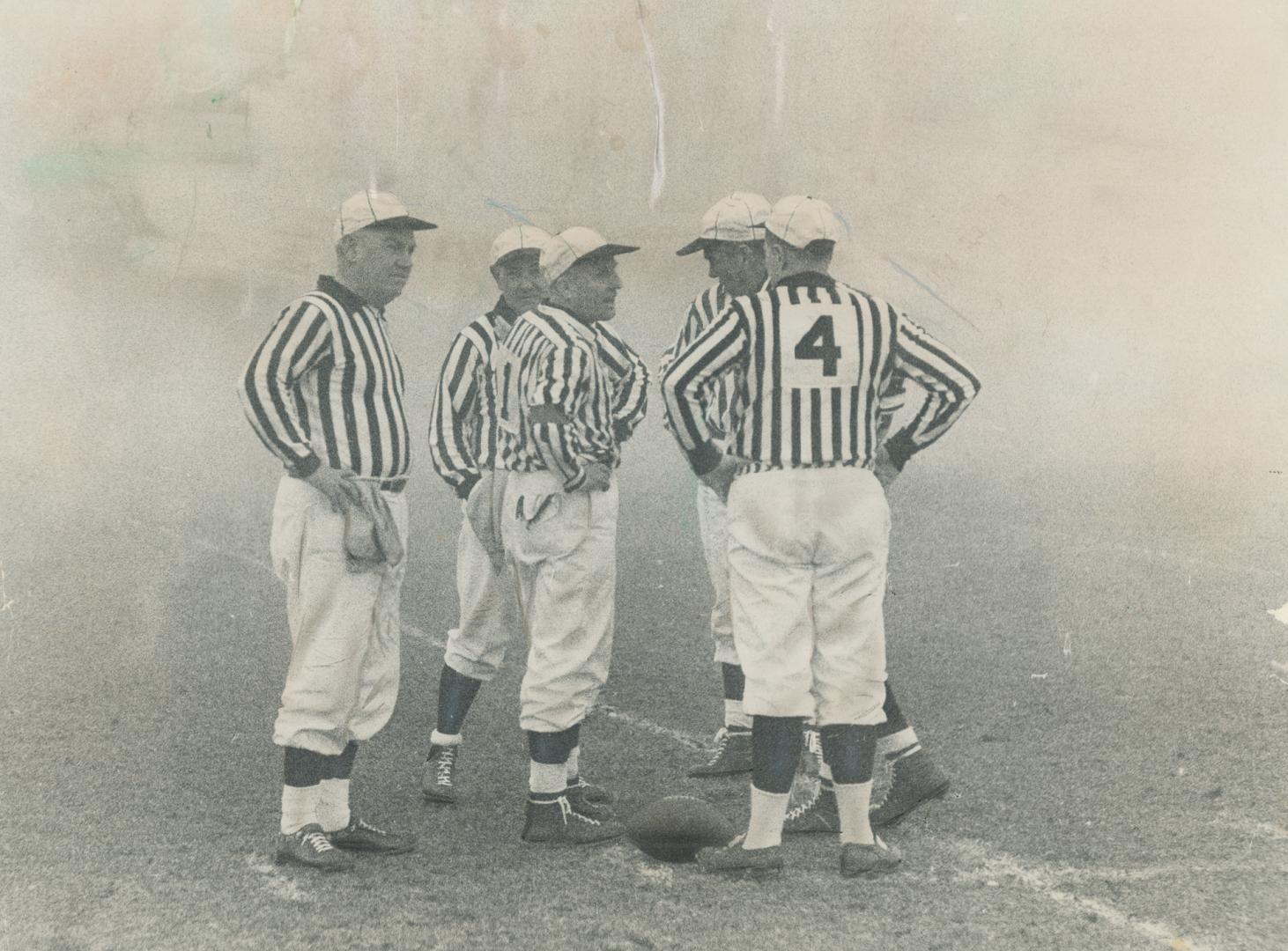 Grey Cup -- but where are the players? Game officials stand alone in the fog at the scene of the zaniest Grey Cup in history. The game was finally hal(...)