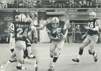 Key interception, final one of four for day by Al Brenner (25) of Tiger-Cats, helped send Argos to a 26-16 defeat at Hamilton yesterday and put Toront(...)