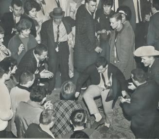 A fan doing the twist is a show-stopper at a hotel party