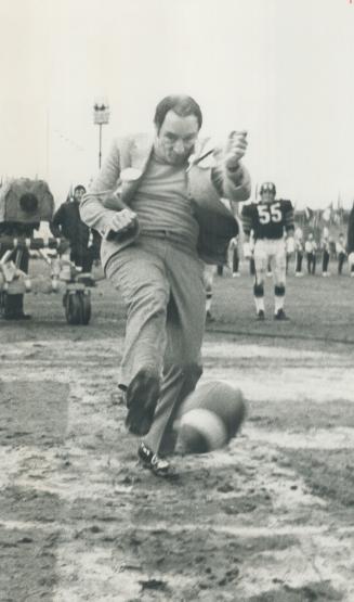 Not a Mudder apparently, Prime Minister Pierre Trudeau, wearing brand new football cleats, got his foot on the ball all right to kick off today's Grey(...)