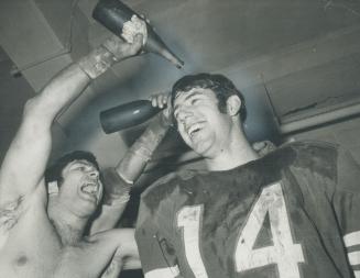 Sonny wade doesn't mind as teammate sprays him with champagne in Als' dressing room after Saturday's Grey Cup victory