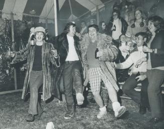 A strange trio of cheerleaders, Peter Pozak, Tom Hilliard and John Watson, provided lively entertainment for Grey Cup spectators who gathered at the W(...)