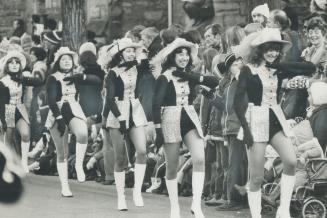 Scantily dressed majorettes were twirling and whirling to keep warm as Hamilton's Grey Cup parade wound along chilly streets