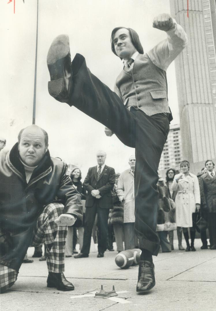 Kick-off for grey cup week. Booting ball 94 feet, Metro Chairman Paul Godfrey defeats the Metro mayors in kick-off for Grey Cup week at Nathan Phillip(...)
