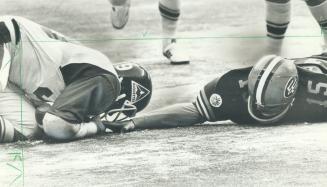 Fumble: Als' Wally Buono (left) pulls in loose ball, right out of the hand of Eskimos' Stuart Lang