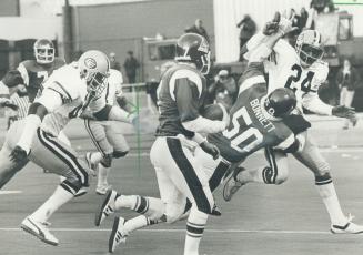 Joe Barnes rides Pat Bonnett's block on Ed Jones to Alouette touchdown in fourth quarter