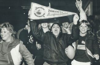 We're No. 1! Toronto's boat came in at last yesterday and thousands of jubilant fans like these thronged Yonge St. to celebrate the Argos' thrilling 1(...)