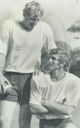 Compounding confusion among Argonaut-watchers at training camp are look-alike quarterbacks Greg Barton (left) and Joe Theismann. Lack of sweater numbe(...)