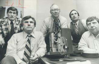 Argo coaches, left to right, Mike Faulkner, Forrest Gregg, Dick Evans, Chuck Hutchinson and Chuck Dickerson watch film