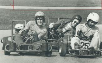 Flat-out racing. Scott Bernier, 20 (left), Dave Ross, 24, and Ken Grant, 28, lean into the corner yesterday as they ngotiate the Goodwood Park Kartway(...)
