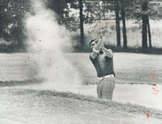 Sending Up cloud of dust, Hugh Bearg blasts out of sand trap at Oakdale club in qualifying round yesterday for The Star-sponsored Ontario Amateur golf(...)