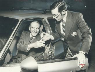 In Picture at right, George Clifton, former director of the Ontario Professional Golf Association is sitting at wheel of new car given him by associat(...)