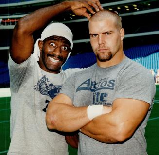 Carl Brazley checks out the newly shorn pate of teammate Chris Gaines as the Boatmen prepared for tonight's game against Winnipeg. Bombers won 34-17 four weeks ago and Argos want revenge