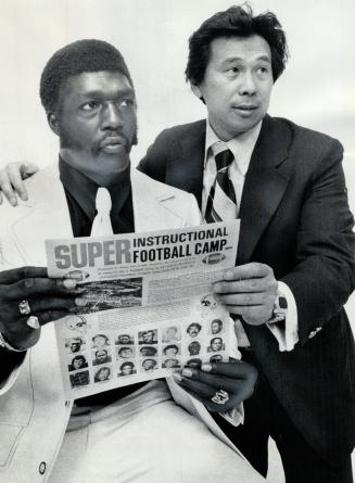 Altie Tayjor, Detroit Lions' star running back, chats with Max Ma, president of Super Instructional Football Camp, about his duties as one of many instructors