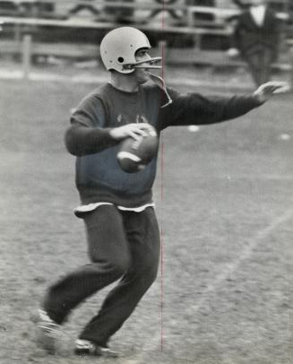 Bill van Burkleo, quarterback, flanker and defensive halfback, works out with Toronto Argonauts