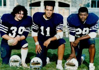 Below, Jackson is flanked by fullback Paul Ferraira, left, and tailback Steve Mattison