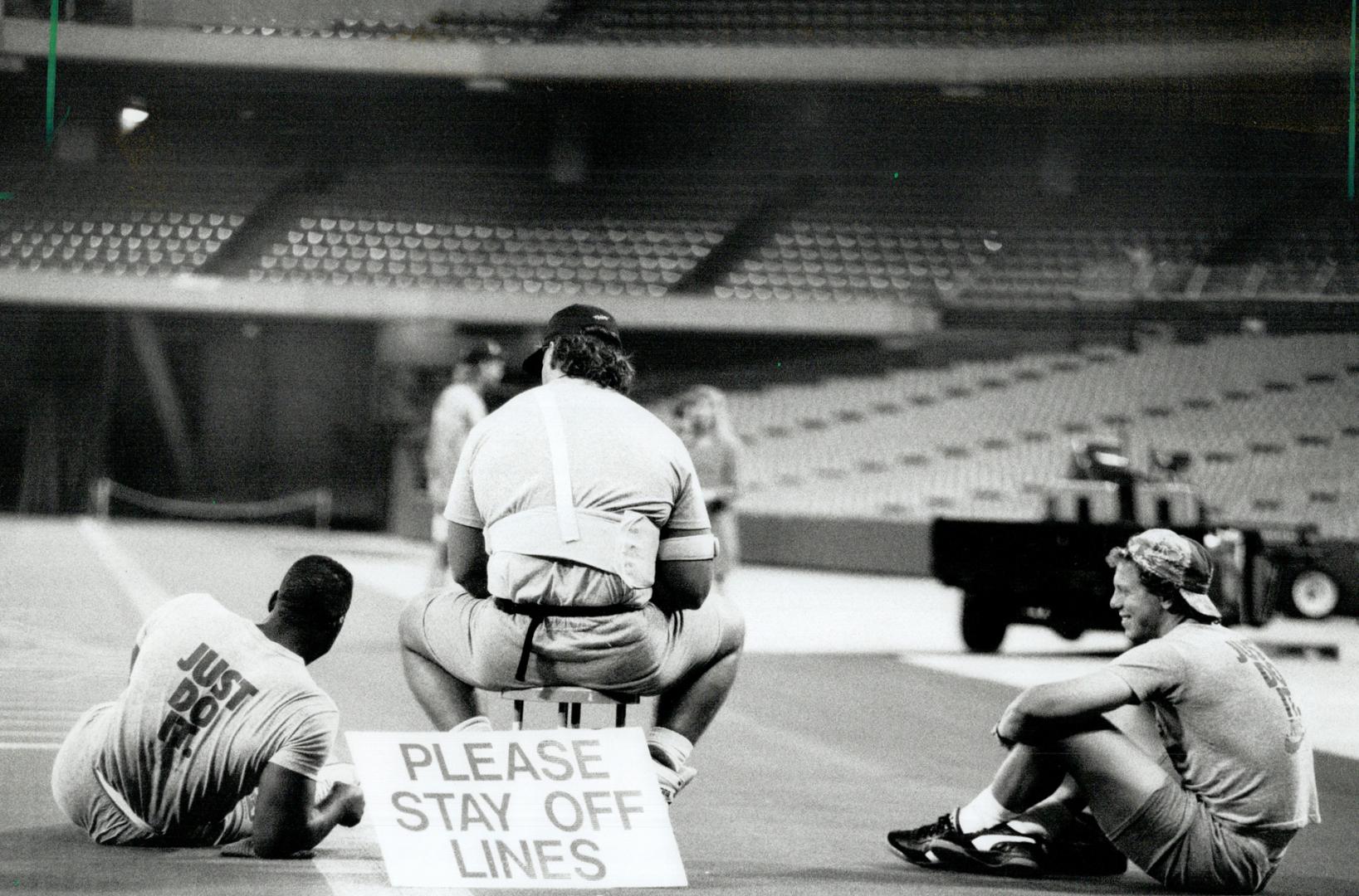 Yeah? Sez Who? Argo players taking a break from practice at the SkyDome yesterday weren't supposed to mess up freshly marked lines on the field but, w(...)