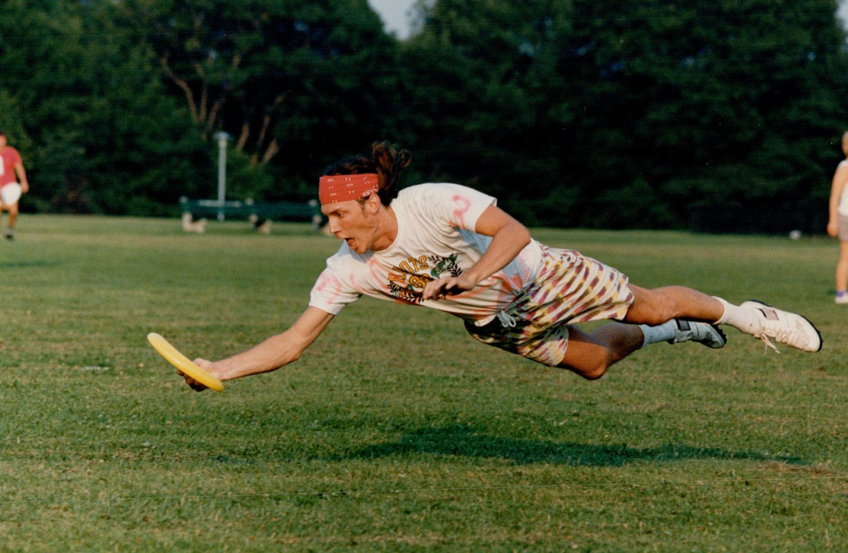 Ultimate action: Don Baker gets horizontal for a catch in Toronto Ultimate league play