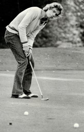 Hugh Brown curves putt towards cup on Don Valley course en route to nine-hole 38 in leading Malvern to 15-0 win over North Toronto in TSSAA golf yesterday