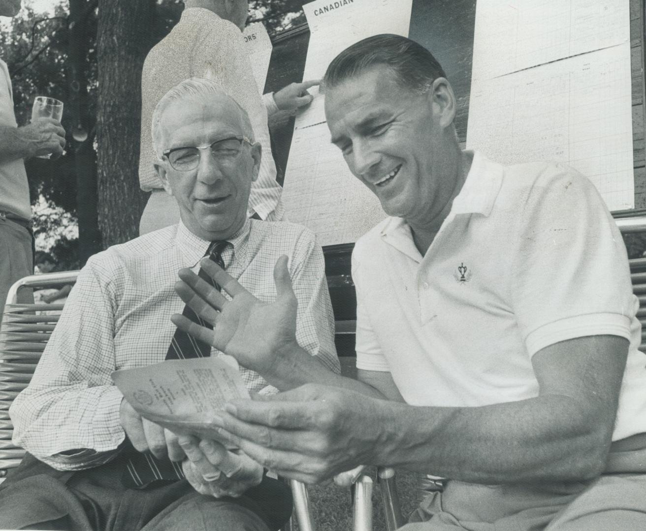 Seniors' tourney co-champs compare notes, Sandy Somerville (left) and Gord Taylor