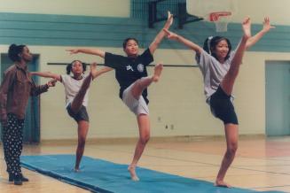 Coach Rachele Hosten with Regent Park Gymnastics team Souphaphone Souphommany chanh Thao Nguyen and Phyra Prum