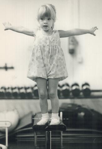 Teeter toddler, Hayley Walkden, 3, balances on a beam in the Tumble Tots recreational gymnastics program at the Yamanaka Centre, 3251 Kennedy Rd., Scarborough. Call 226-5266