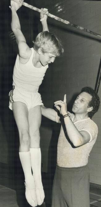 High-flying gymnast Bob MacLauchlan, 13, does a flip from a trampoline, left, and whirls on a high bar under guidance of coach Eugene Galpering at Hum(...)