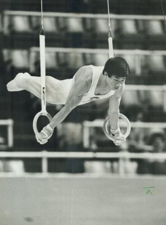China's Yubin Huang tied for first on rings