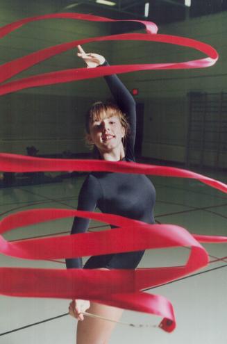 In a whirl: Rhythmic gymnast Amanda Malone, 17, works out at the club she runs out of three Mississauga schools