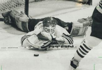 Keeping a low profile: Oshawa goalie Mike Fountain looks down and out on this play but he could hold his head high after the Generals defeated the Soo Grey-hounds 4-2 in Game 5 of OHL championship