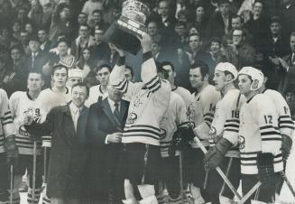 Great moment for Orillia comes as captain John Chasczewski waves cup Terriers have just won as champions of senior hockey in Ontario. Watching, along (...)